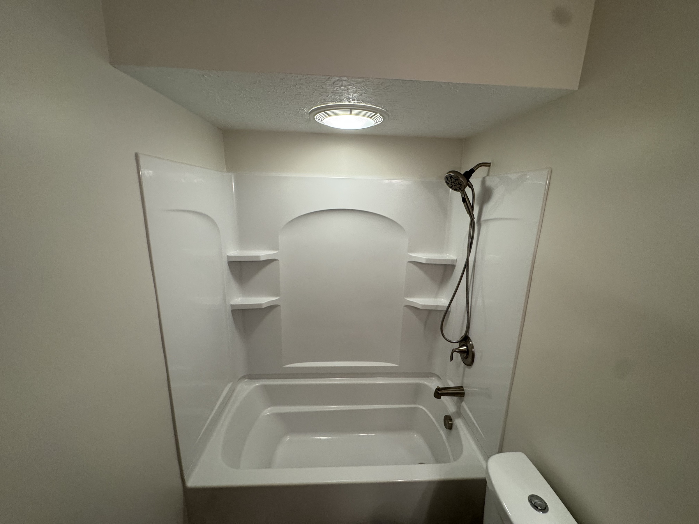 Completed bathroom with freshly painted walls