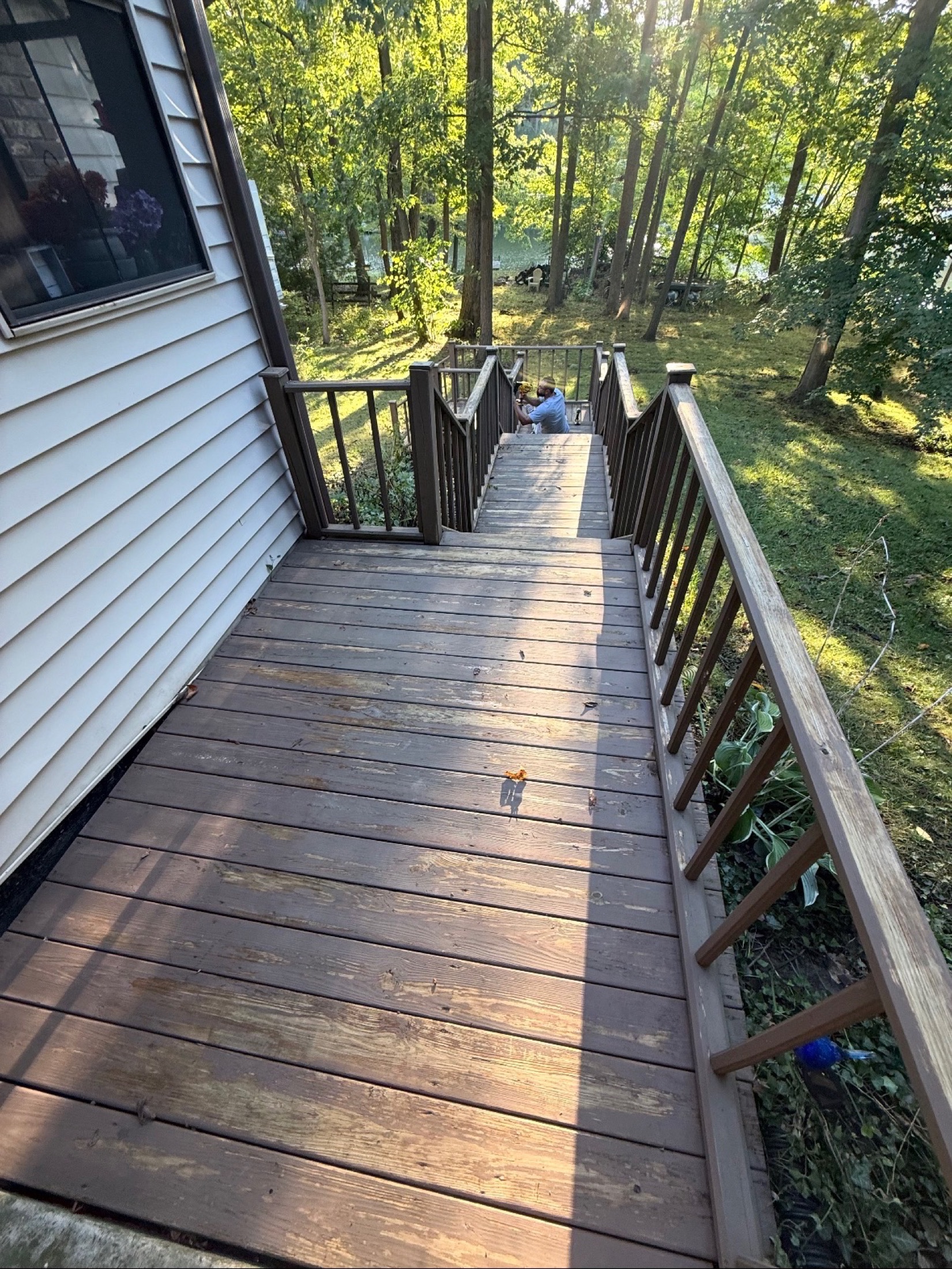 Weathered deck and steps before restoration