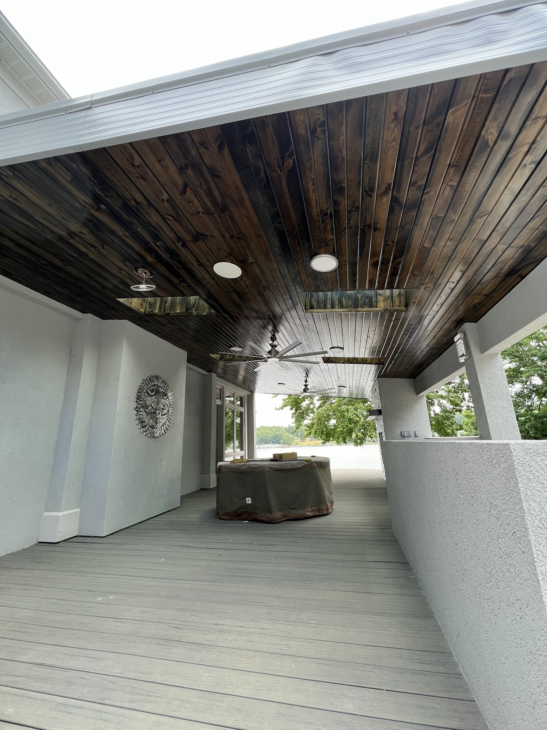 Lakeside porch ceiling after dark wood staining